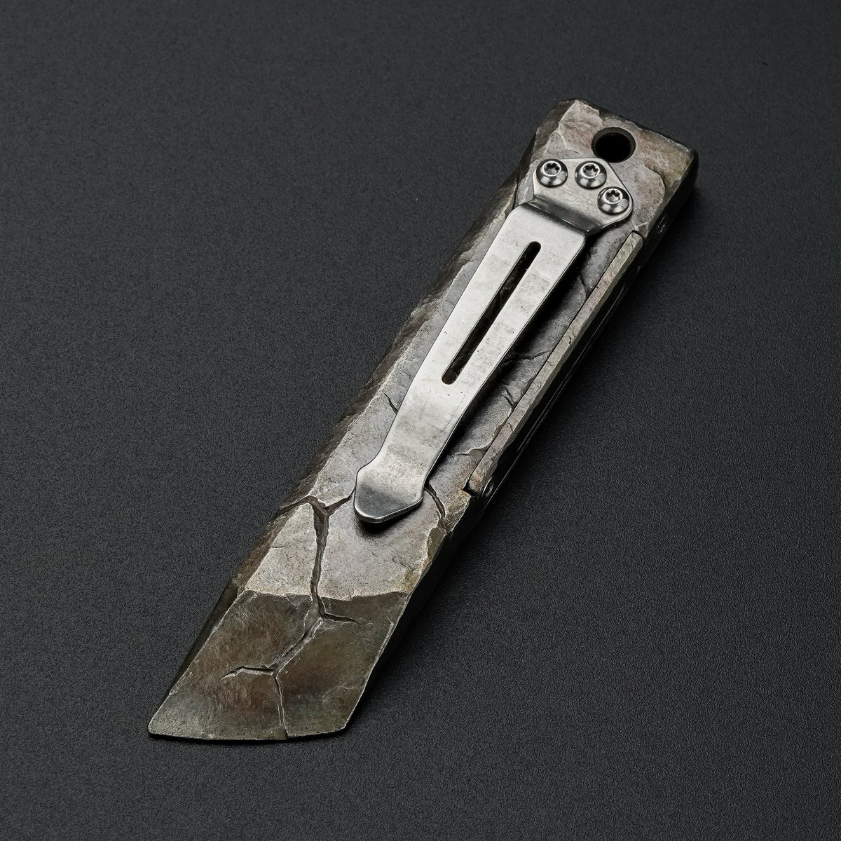 MecArmy RL4-HC hand-carved titanium EDC pry bar with cracked texture, shown from the pocket clip side