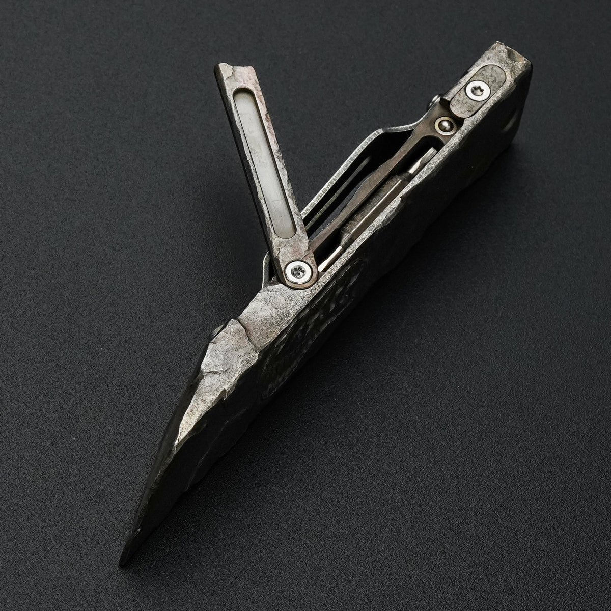 MecArmy RL4-HC hand-carved titanium EDC pry bar dinosaur skull edition shown open with the integrated tool compartment