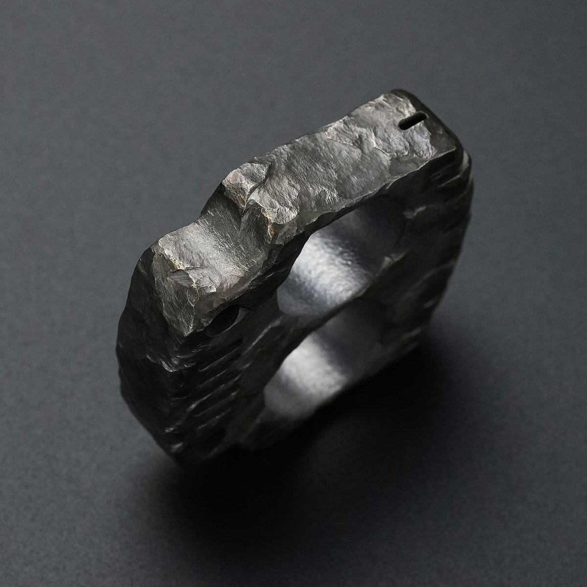 MecArmy TKF-HC hand-carved titanium EDC knuckle showing the sculpted side and rock-textured finish