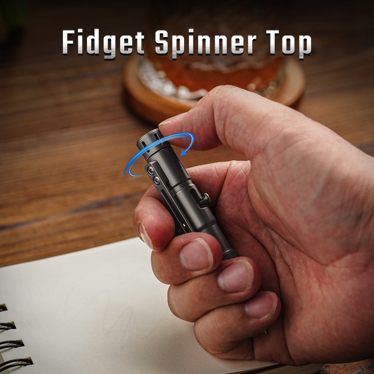 TPX11 fidget spinner top rotating under the thumb during handheld use.